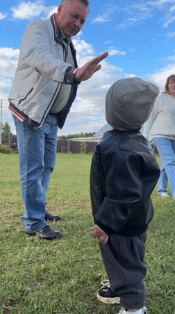 Family enjoys afternoon playtime in rural Russian village