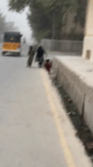 Everyday street life on a hazy afternoon in Kandahar
