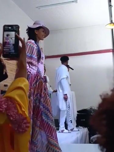 Fashion show features runway model with live musical performance
