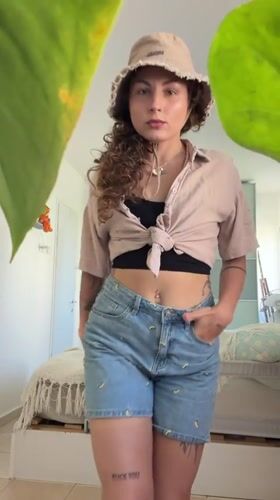 Woman takes mirror selfies in Kiryat Bialik apartment