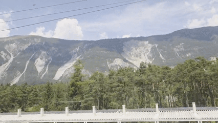Sweeping mountain views from road, rail, and open ground
