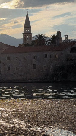 Budva waterfront at sunrise: beach, streets, and marina