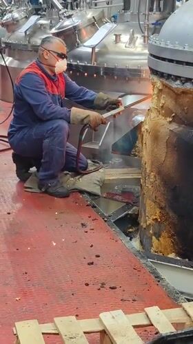 Industrial torch work on damaged metal objects in Kolpino