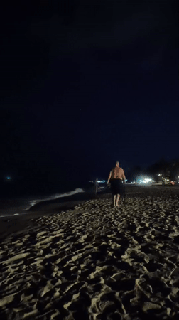 Nighttime beach walker with walking stick observed in Thailand