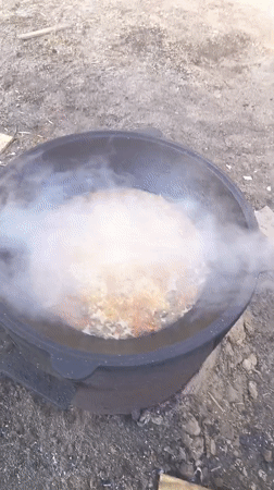 Cooking pot with rice and vegetables filmed in Nizhnevartovsk