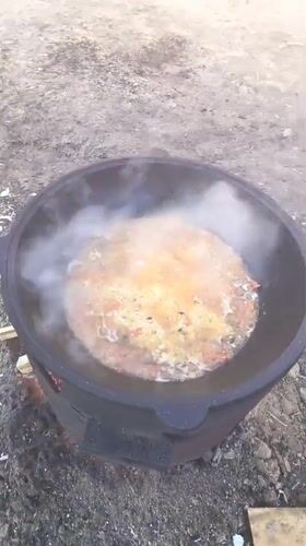 Cooking pot with rice and vegetables filmed in Nizhnevartovsk