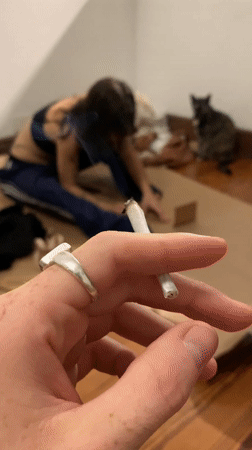 Late-night indoor smoking scene captured in Buenos Aires apartment