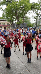Street performers in colorful costumes draw crowds in Tinaquillo