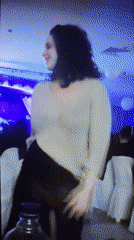 Woman dancing captured at evening event in Varna, Bulgaria