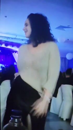 Woman dancing captured at evening event in Varna, Bulgaria