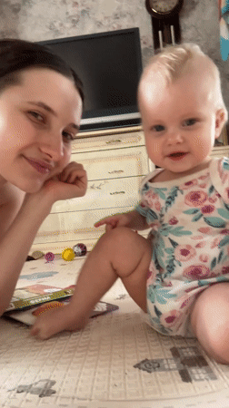 Mother and baby playtime documented in Pokrov home