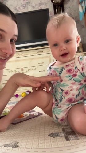 Mother and baby playtime documented in Pokrov home