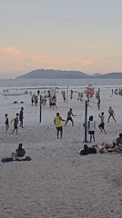Evening beach volleyball and leisure activities documented in Cabo Frio