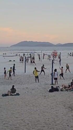 Evening beach volleyball and leisure activities documented in Cabo Frio
