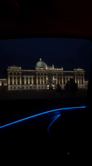 Classical Moscow building with green dome photographed at night