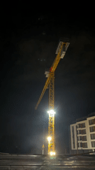 Construction crane illuminated at night development site in Sofia