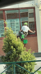 Window washer cleans building exterior in Izhevsk, Russia