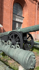 Tourists explore artillery displays at Saint Petersburg military museum