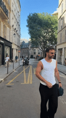 Film crew and pedestrians observed on Paris street