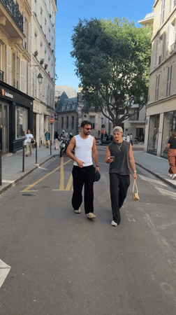Film crew and pedestrians observed on Paris street