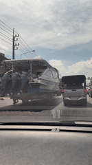 Large powerboat with triple engines transported through Ko Kaeo