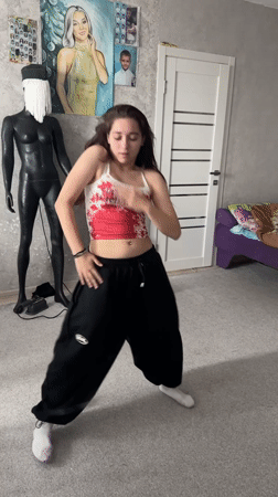 Woman breakdances in bedroom, startles herself laughing in Abakan