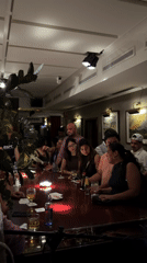 Friends gather for karaoke night at local bar