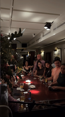 Friends gather for karaoke night at local bar