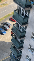 Rope-access workers maintain high-rise building exterior in Hertsmere
