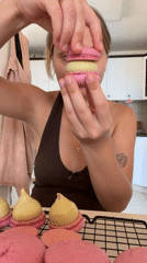 Fresh pink macarons cooling in a Tel Aviv kitchen