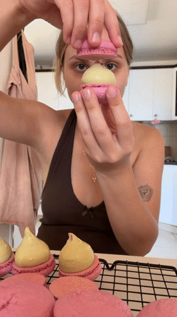 Fresh pink macarons cooling in a Tel Aviv kitchen