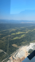 Quarry meets forest in aerial view over rural Bulgaria