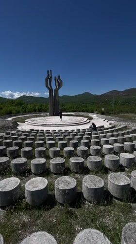Visitors explore Montenegro's Barutana Memorial Park on sunny spring morning
