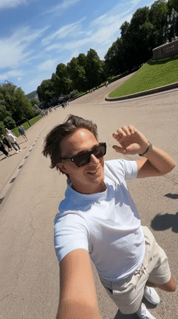 Tourist films selfie video at Royal Palace Oslo