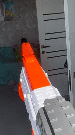 Woman plays with toy guns in Abakan home