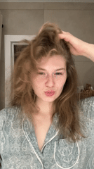 Woman in green pajamas observed in Kazan room