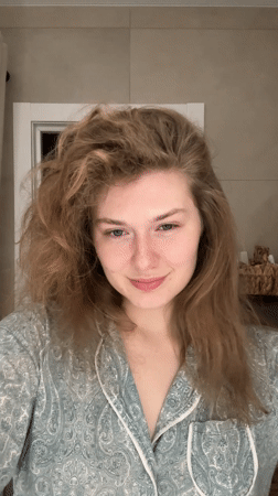 Woman in green pajamas observed in Kazan room