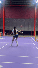 Badminton match on a purple indoor court in Ko Samui