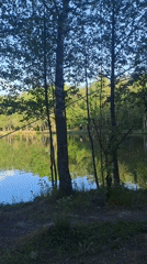 Person ziplines over lake in Меткомелино, Russia