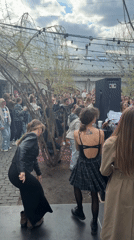 Women address crowd at outdoor Moscow gathering