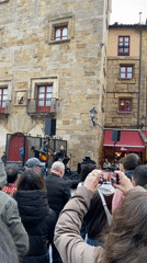 Street musicians perform in historic Gijón city square
