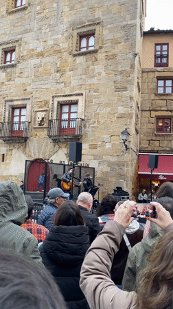 Street musicians perform in historic Gijón city square
