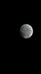 Bright moon observed through drifting clouds over Tbilisi