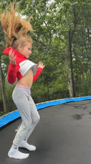 Backyard trampoline session in rural Belarus with scattered misc content