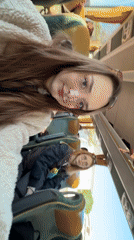 Two women ride morning bus in Kragujevac, Serbia
