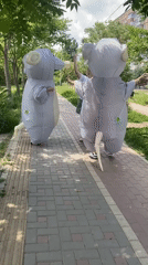 Mouse-costumed performers entertain woman on Kropyvnytskyi walkway