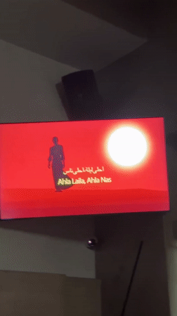 Music video with silhouetted figure observed on TV in Sandanski