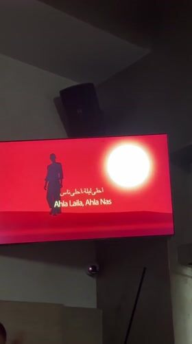 Music video with silhouetted figure observed on TV in Sandanski