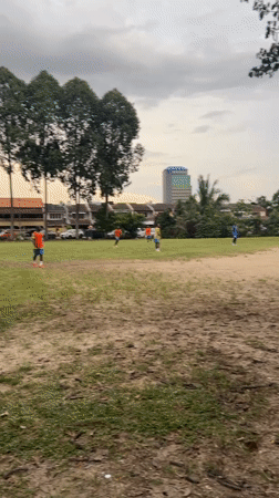 Soccer game played on grassy field in Subang Jaya