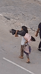 Street life in Khan Yunis — people moving, kids walking